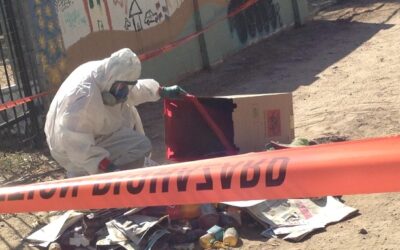 Hazmat crew cleans urine bottles out of alley